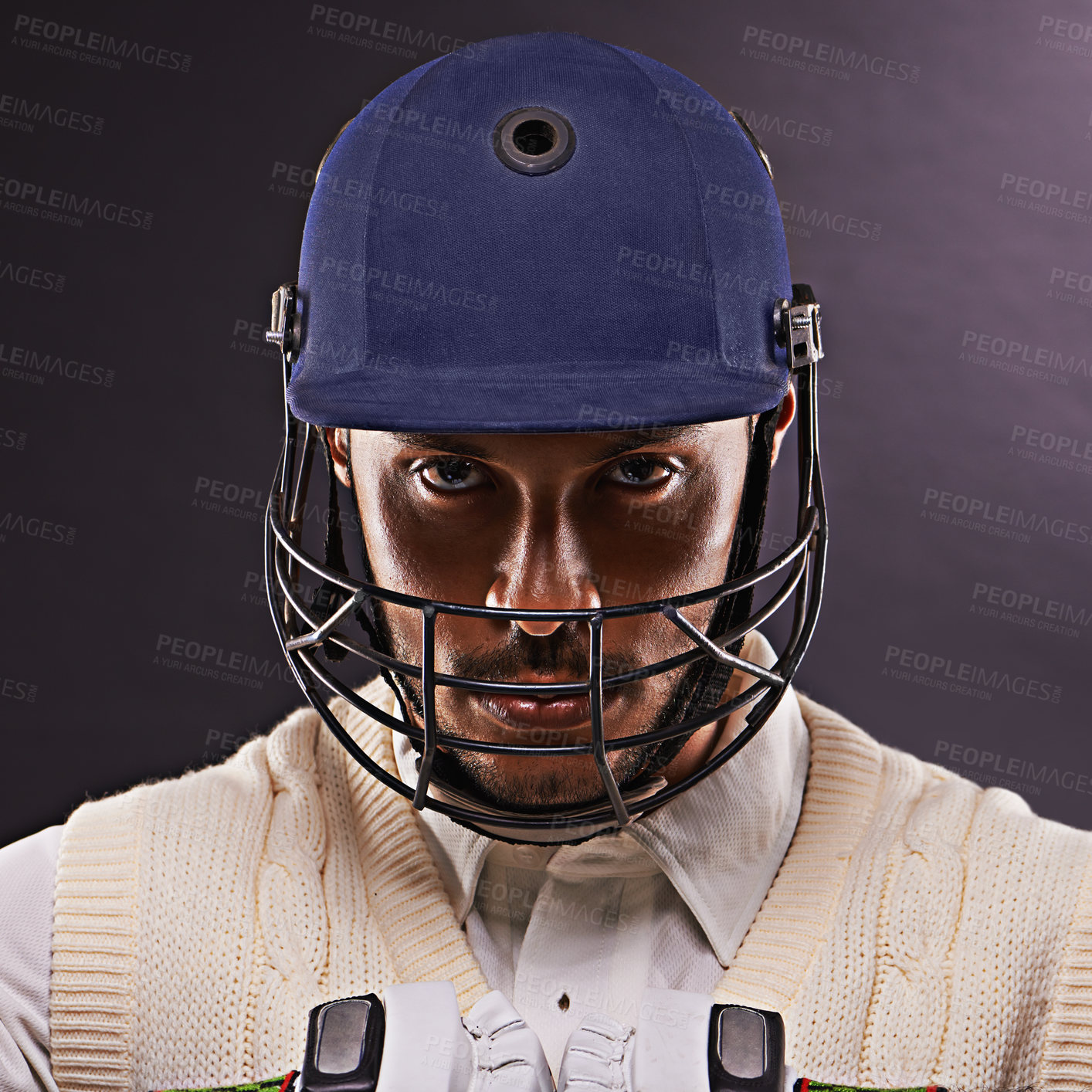 Buy stock photo A cropped shot of an ethnic young man in cricket attire isolated on black