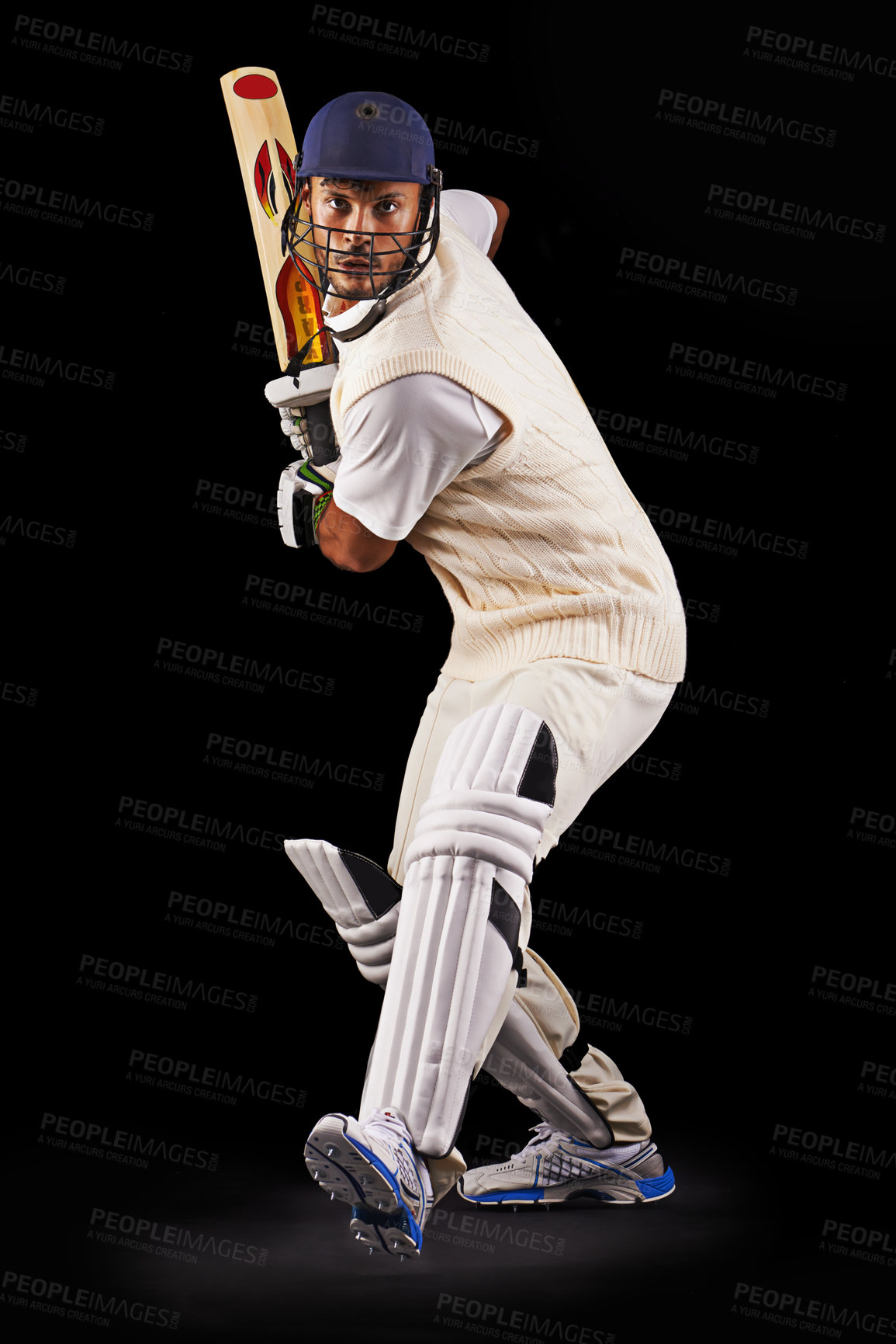 Buy stock photo A cropped shot of an ethnic young man in cricket attire isolated on black