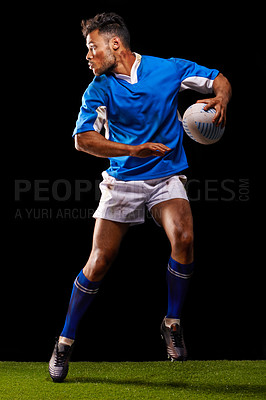 Buy stock photo Rugby, night and man sports athlete running in dark studio background while training, wellness and fitness. Exercise, workout and professional career of sport male person or player on grass