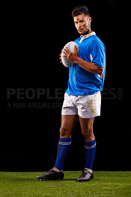 Buy stock photo Rugby, background and portrait of man at night for training, competition and sportswear dark studio. Confidence, player and male athlete with ball for professional sport, workout or exercise on grass