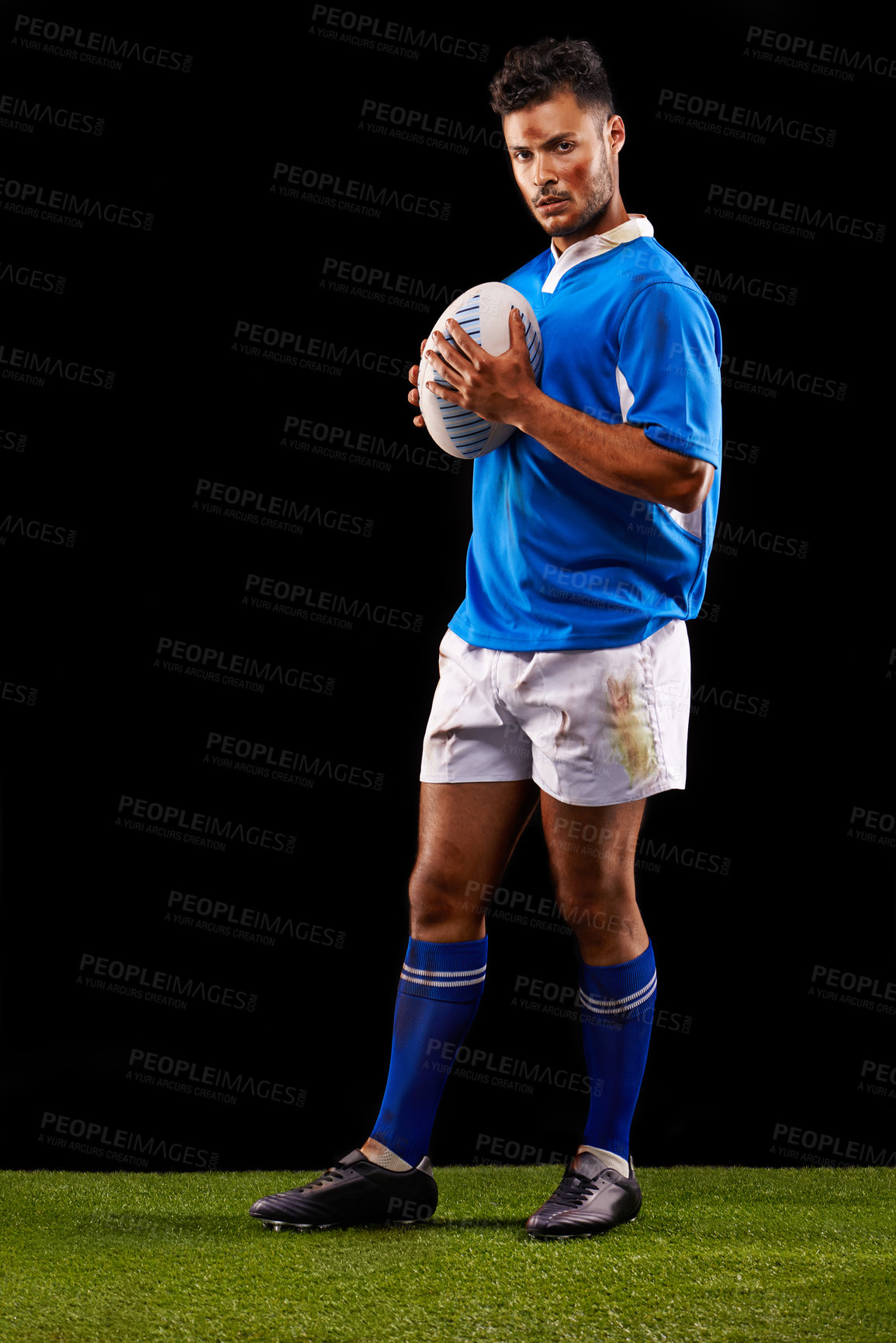 Buy stock photo Rugby, background and portrait of man at night for training, competition and sportswear dark studio. Confidence, player and male athlete with ball for professional sport, workout or exercise on grass