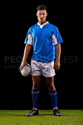 Buy stock photo Rugby, black background and portrait of man in studio for training, competition and sportswear. Confidence, player and male athlete with ball for professional sport, workout or exercise on grass