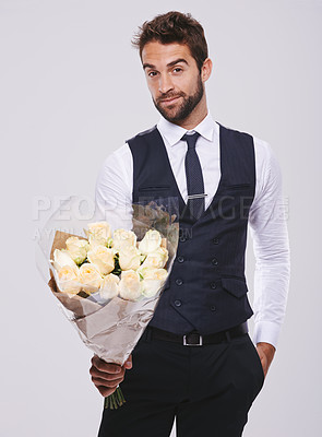 Buy stock photo Studio, smile and portrait of businessman with flowers for gift giving, present offer and kind gesture. Male person, roses and face with happiness for romance, love and bouquet on white background