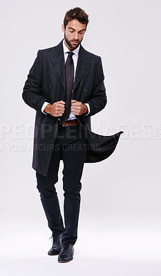 Buy stock photo Studio shot of a handsome and well-dressed young man