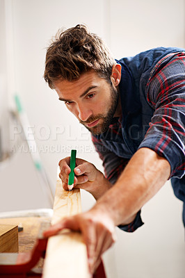 Buy stock photo Man, wood and pencil for measure for construction, home development and building renovation. Carpenter, maintenance employee and male repairman worker on a contractor job of builder working in house