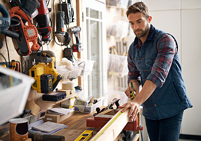 Buy stock photo Man, wood and tape measure for construction, home development and building renovation. Carpenter, maintenance employee and male repairman worker on a contractor job of builder working in house