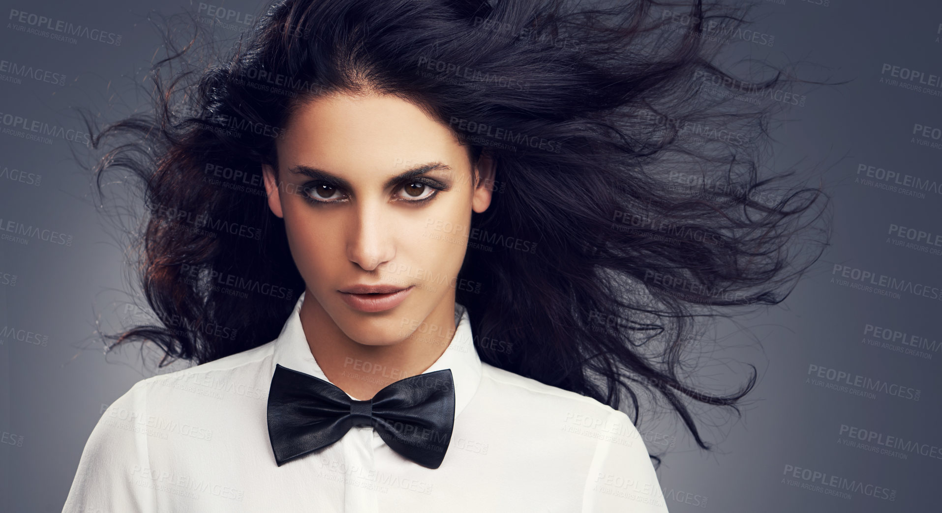 Buy stock photo Hair care, bow tie or portrait of fashion model in studio with vintage clothes, makeup or classy aesthetic. Face, gothic or woman with retro style, elegance or confidence isolated on grey background