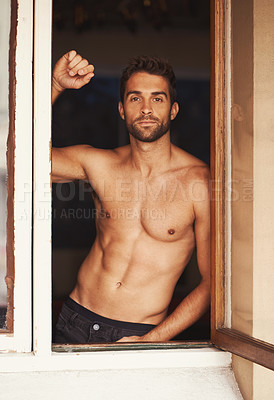 Buy stock photo Cropped shot of a shirtless young man at home