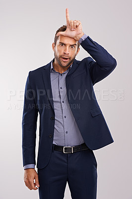 Buy stock photo Portrait, loser gesture and man with business, fail and mistake on a white studio background. Person, employee or entrepreneur with L symbol, emoji or sign with icon or silly with negative expression