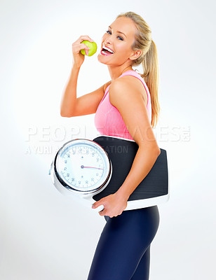 Buy stock photo Woman, portrait and scale in studio for apple, smile and excited for results of diet or detox. Female person, nutrition and journey for calories burned target, organic snack and white background