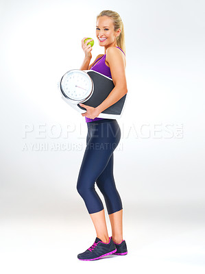 Buy stock photo Woman, portrait and scale or apple for body, studio and excited for results of diet or detox. Female person, nutrition and journey for calories burned target, organic snack and white background