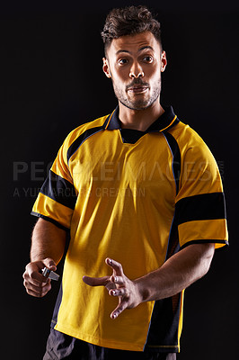 Buy stock photo Face, referee or man with warning, foul call or penalty review in sports, rugby or football game at night. Soccer match, dark or person in studio with discipline, rules or caution on black background