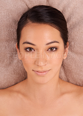 Buy stock photo Woman, relax and portrait in spa for massage, wellness and skincare for body, treatment and detox for luxury. Happy or young person and smile for rest on table for break, care and beauty for holiday
