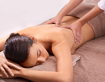 Buy stock photo Shot of a beautiful young woman enjoying a relaxing massage