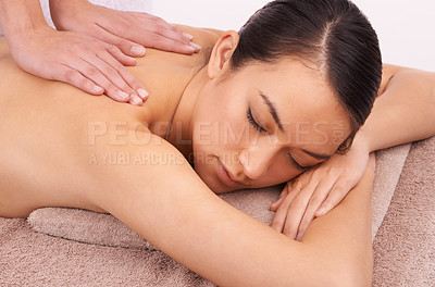 Buy stock photo Hands, zen and woman with back massage at spa for wellness, self care and grooming treatment in studio. Skin, calm and female person with masseuse for body routine on table by white background.