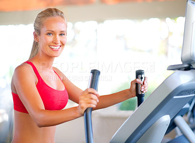 Buy stock photo Woman, gym and fitness with machine for wellness and cardio training for elliptical exercise. Athlete, happy and routine with confidence and natural strength for wellbeing or workout portrait