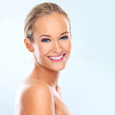 Buy stock photo Studio, skincare and portrait of woman with self care for treatment, dermatology and facial glow. Female person, smile and confidence with cosmetics, healthy skin and wellness on blue background
