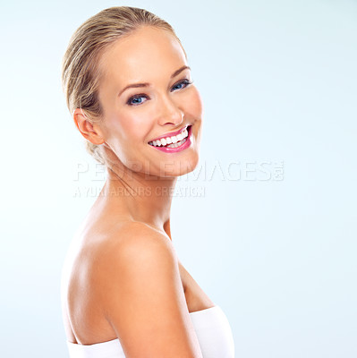 Buy stock photo Portrait, woman and skincare in studio with dermatology, cosmetic treatment or facial glow. Female person, happy and smile with confidence for self care, healthy skin or wellness on blue background
