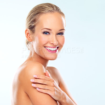 Buy stock photo Portrait, makeup and skincare of happy woman in studio for glow, shine or touch body for health isolated on blue background mockup. Face, smile and beauty of blonde model in cosmetics for dermatology