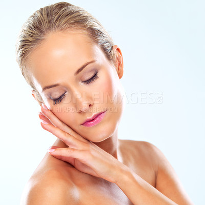 Buy stock photo Soft, makeup and calm woman with hands on face in studio for wellness, shine or results on white background. Beauty, glow and female model with skincare cosmetics, treatment or cosmetology promotion