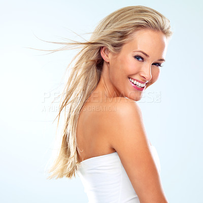 Buy stock photo Woman, portrait and wind for hair growth in studio, smile and cosmetics for keratin treatment on white background. Person, conditioner and breeze for dermatology or texture, confidence and shampoo