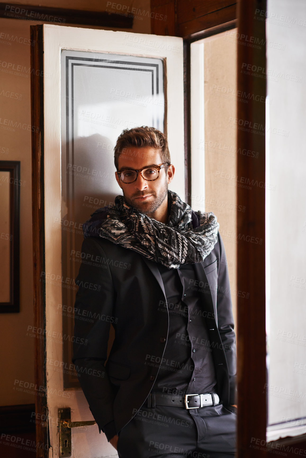 Buy stock photo Man, portrait and fashion in house for style and clothes for bold and trendy indoor. Young person, smile and handsome with scarf and jacket for winter wear and comfort for edgy and aesthetic