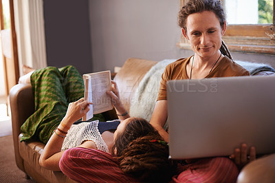 Buy stock photo Relax, book and laptop for happy couple, couch and living room in home. Technology, computer and reading or learning on weekend or vacation, house or lounge or partner together for bonding on holiday