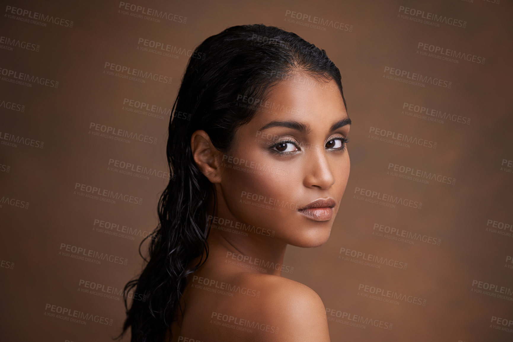 Buy stock photo Hair, wet or portrait of Indian woman in studio for beauty, wellness or shine cosmetics on brown background. Haircare, cleaning or calm lady model face with shampoo, results or scalp detox treatment