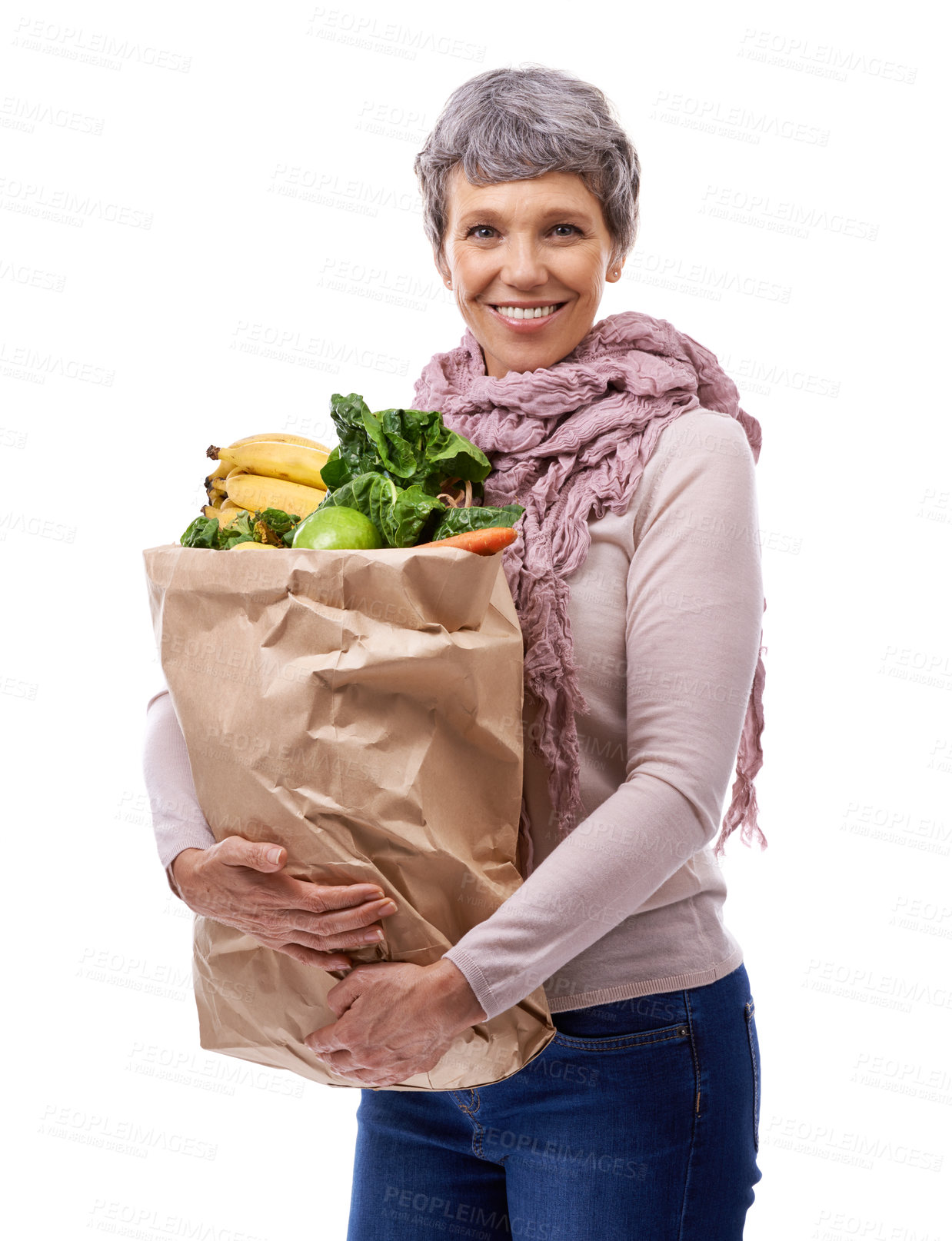 Buy stock photo Woman, paper bag and portrait with vegetables for shopping, groceries and consumer for nutrition and fruits in studio. Mature lady, happy and hold produce for health and food on white backdrop 