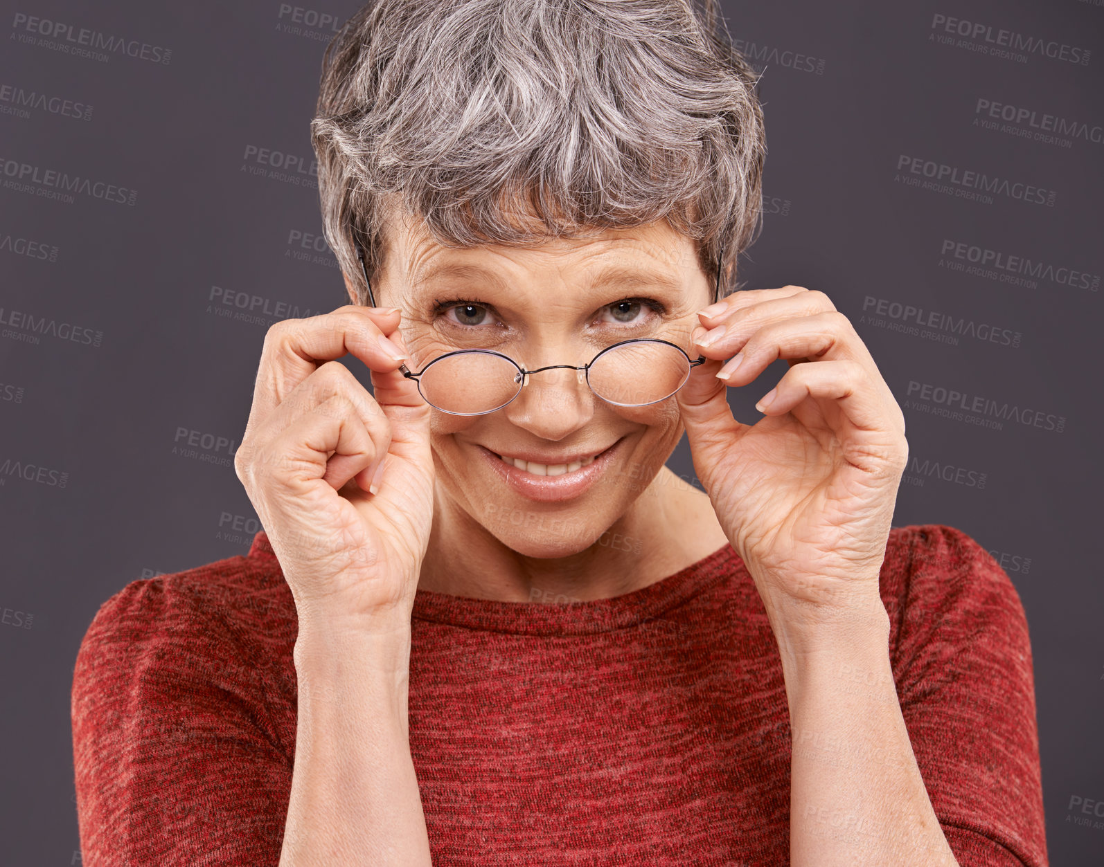 Buy stock photo Portrait, senior woman and glasses with smile, retirement and confident pensioner on a grey studio background. Face, old person and elderly lady with eyewear for clear vision and optometry with joy
