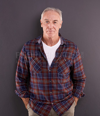 Buy stock photo Studio portrait of an elderly man against a gray background