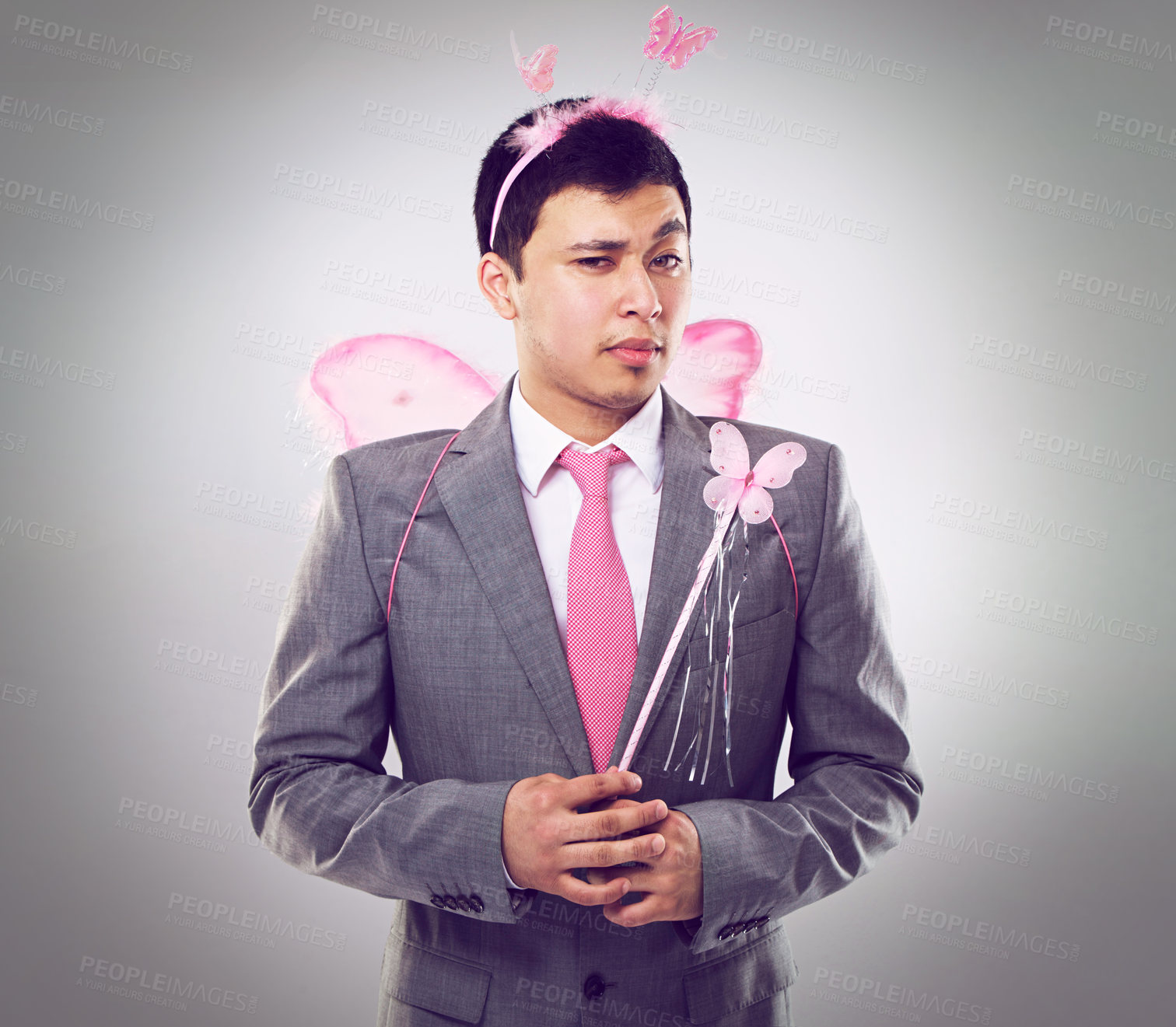 Buy stock photo Business man, fairy costume and portrait with magic in corporate for career growth on grey background. Butterfly, wand and wings, fantasy cosplay for dress up or wish for professional progress