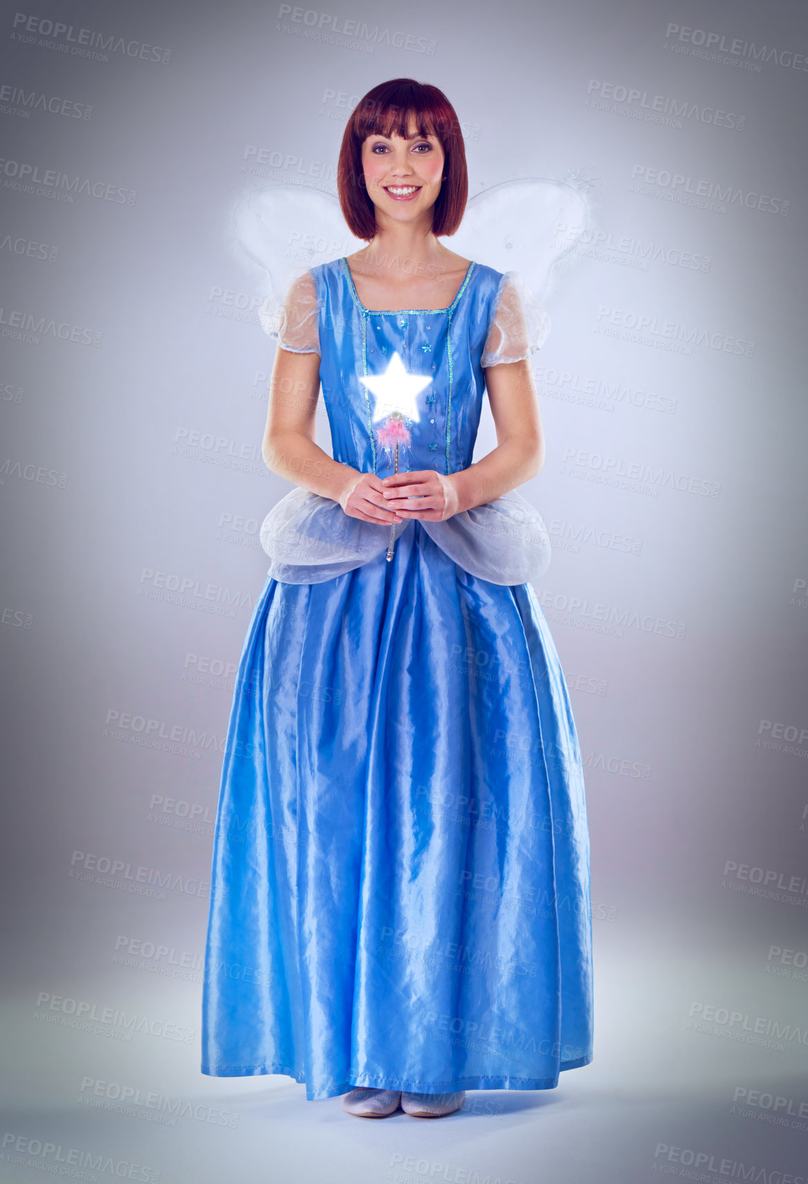 Buy stock photo Woman, fairy godmother and smile in studio portrait with wand, wings and dress for magic by background. Person, fantasy and star with glow, shine and happy with power, wish and surreal fairytale
