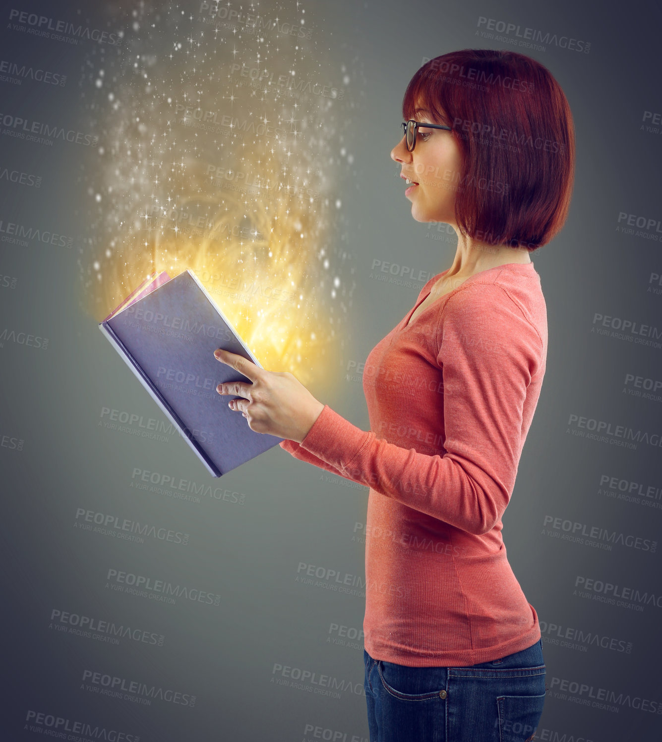 Buy stock photo Profile, glowing book and woman with magic, story and education on grey studio background. Person, model and girl with novel and literature with knowledge and learning with light, creative or fantasy