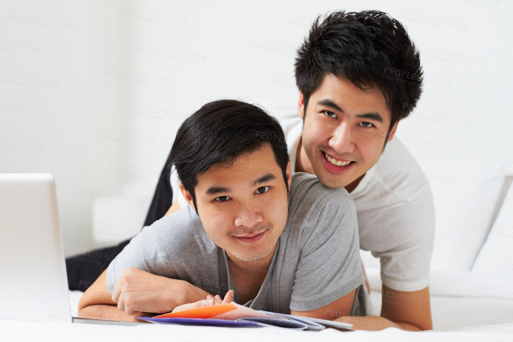 Buy stock photo Portrait, lgbt and love with an asian couple learning together in their home while bonding over education. Study, happy or smile with a gay man and partner in a house, studying as university students