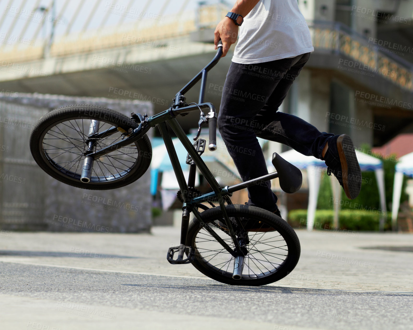Buy stock photo Fitness, cycling tricks and a man with a bicycle for sports, balance and action in the city. Training, energy and a person with a bike for speed, transportation and urban spinning on the concrete