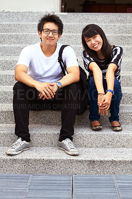 Buy stock photo Portrait, education and an asian couple on steps, sitting outdoor at university together for learning. Love, study or college with a man and woman student on stairs to relax while bonding at break