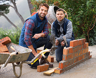 Buy stock photo Construction, bricklayer in portrait and men with brick wall, handyman or contractor with trade, mentor and apprentice in industry. Team, builder and tools, maintenance and renovation for training