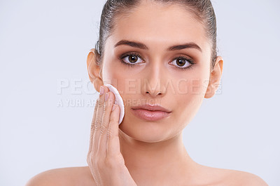 Buy stock photo Face, woman and cotton pad for cleaning makeup from skin, cosmetics and beauty product on white background. Skincare routine, cleanse and wipe in portrait, dermatology and facial treatment in studio