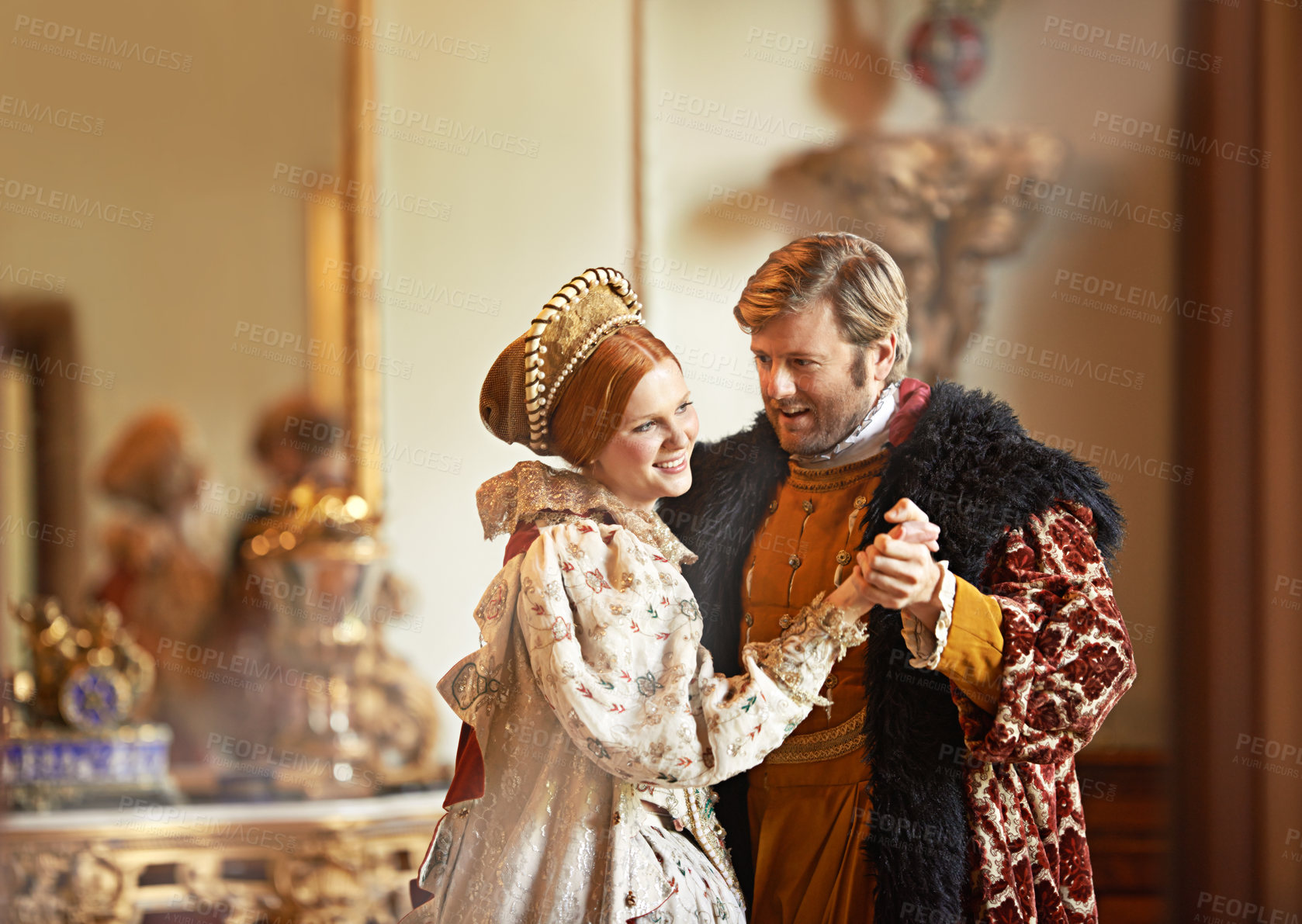 Buy stock photo A king and queen dancing together in their palace