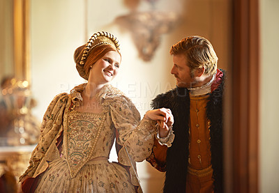 Buy stock photo Royal, man and woman dance in castle together with vintage love, romance and banquet performance. Medieval king, queen or renaissance couple in ballroom holding hands with smile in palace in Europe