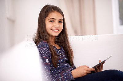 Buy stock photo Portrait, home or kid with tablet for streaming, playing games or watching fun videos on movie website. Social media, online or happy girl with smile or technology to download on app or ebook on sofa
