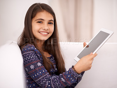 Buy stock photo Portrait, smile or child with tablet for streaming, playing games or watching fun videos on movie website. Relax, house or happy kid with technology to download on social media app on screen on sofa