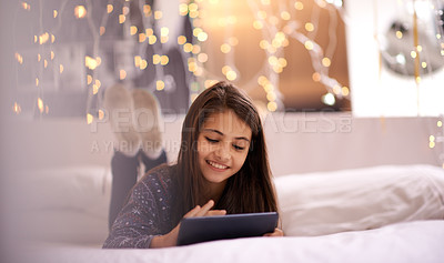 Buy stock photo Shot of a cute little girl using a digital tablet