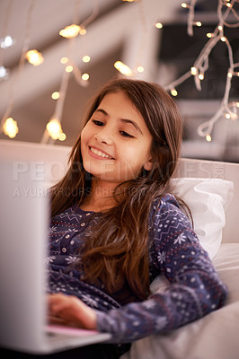Buy stock photo Night, bedroom or child with laptop for streaming, playing games or watching videos on a movie website. Research, house or happy kid with technology to download online or social media app to relax