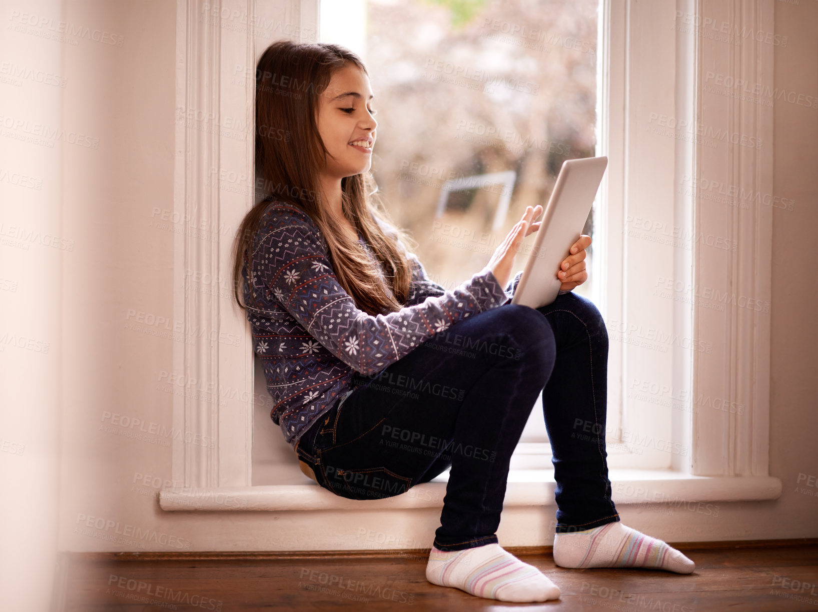 Buy stock photo Girl, child and tablet, technology and communication with ebook for reading and social media at home. Elearning, movie or storytelling app with internet, browsing and digital platform for gaming