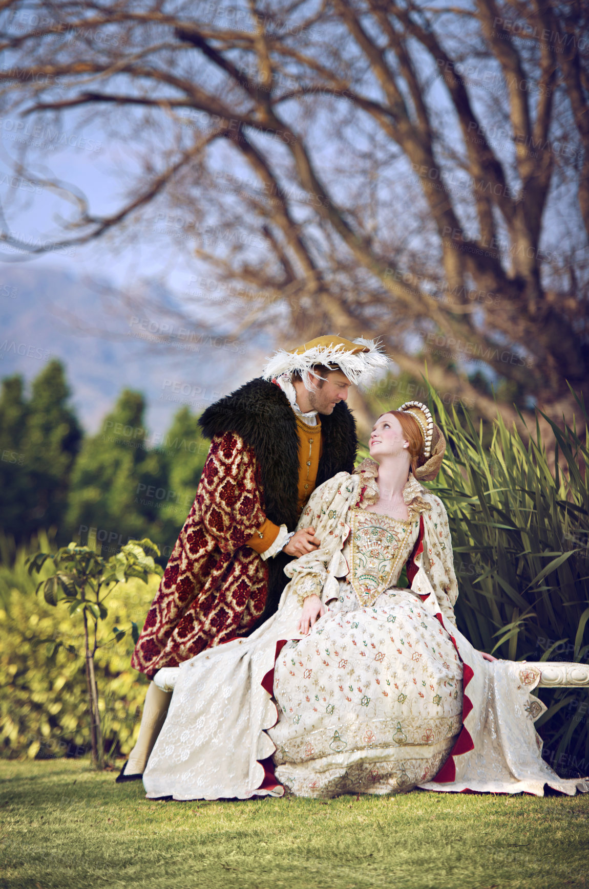 Buy stock photo Shot of a royal couple spending time together at the gardens