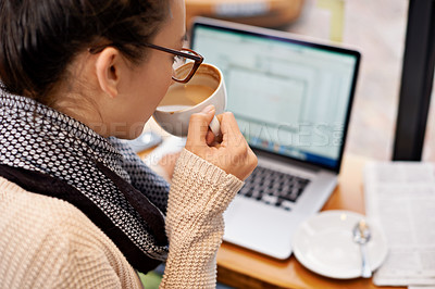Buy stock photo Cropped shot of an attractive young woman surfing the net in a coffee shop