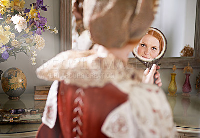 Buy stock photo Reflection, mirror and woman with renaissance, medieval and classic style in a palace bedroom. Luxury, mansion and beauty skincare routine in a home with vintage fashion and care of a queen and ruler