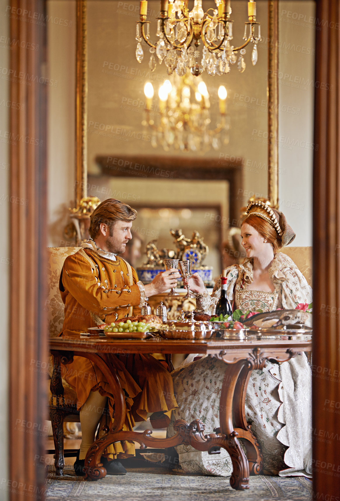 Buy stock photo Royal, man and woman with wine for luxury and toast together for wedding and coronation. King and queen with smile for food with alcohol to drink in palace, happiness and joy for wealth in marriage